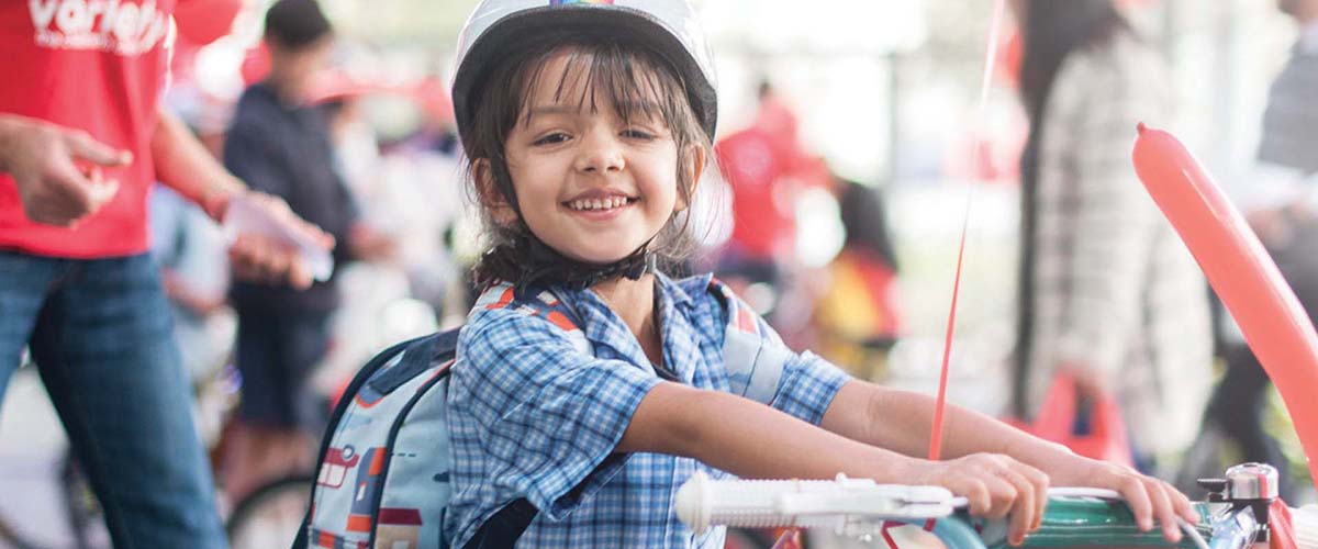 A girl holding a bike