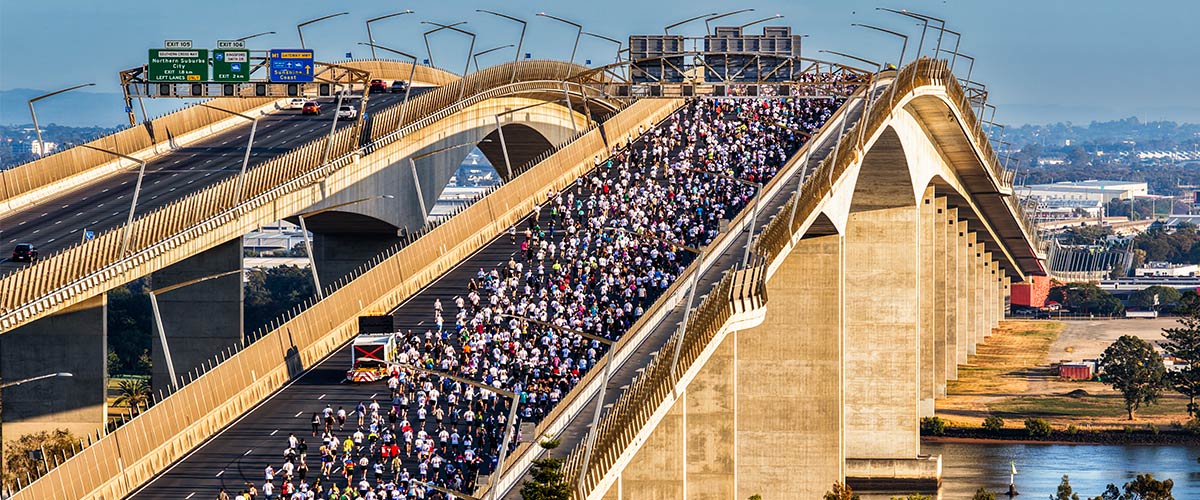 A zoomed out view of Bridge to Brisbane participants running over the Gateway Bridge.
