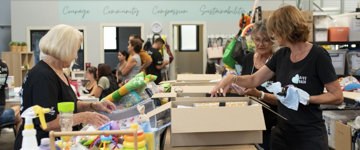 Volunteers sorting items in a warehouse