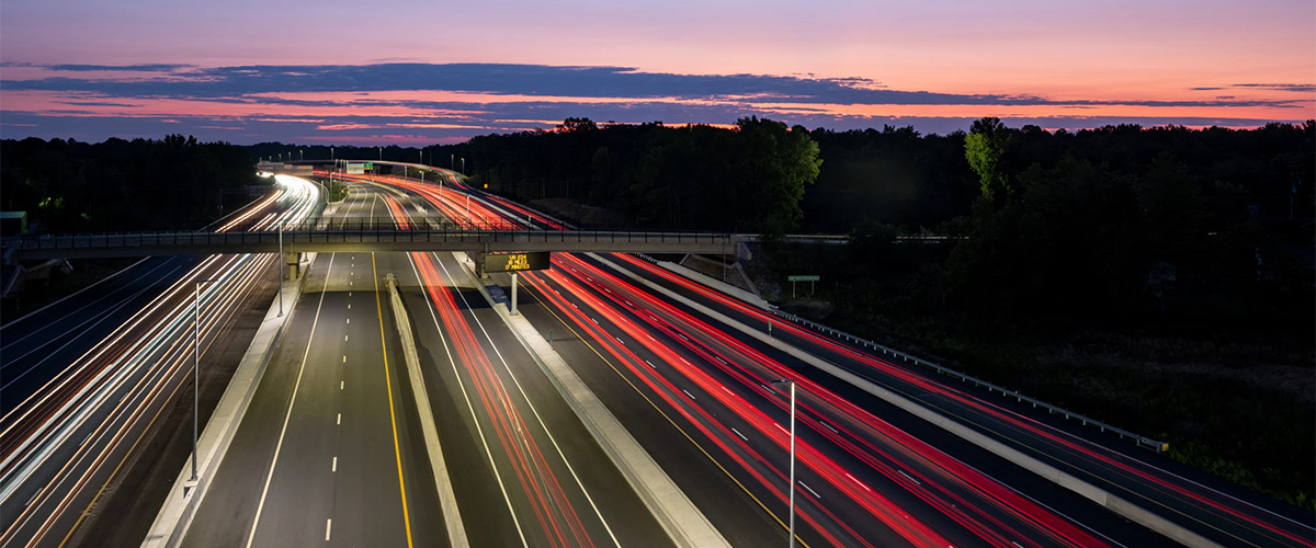 Decorative image of a highway at dusk.